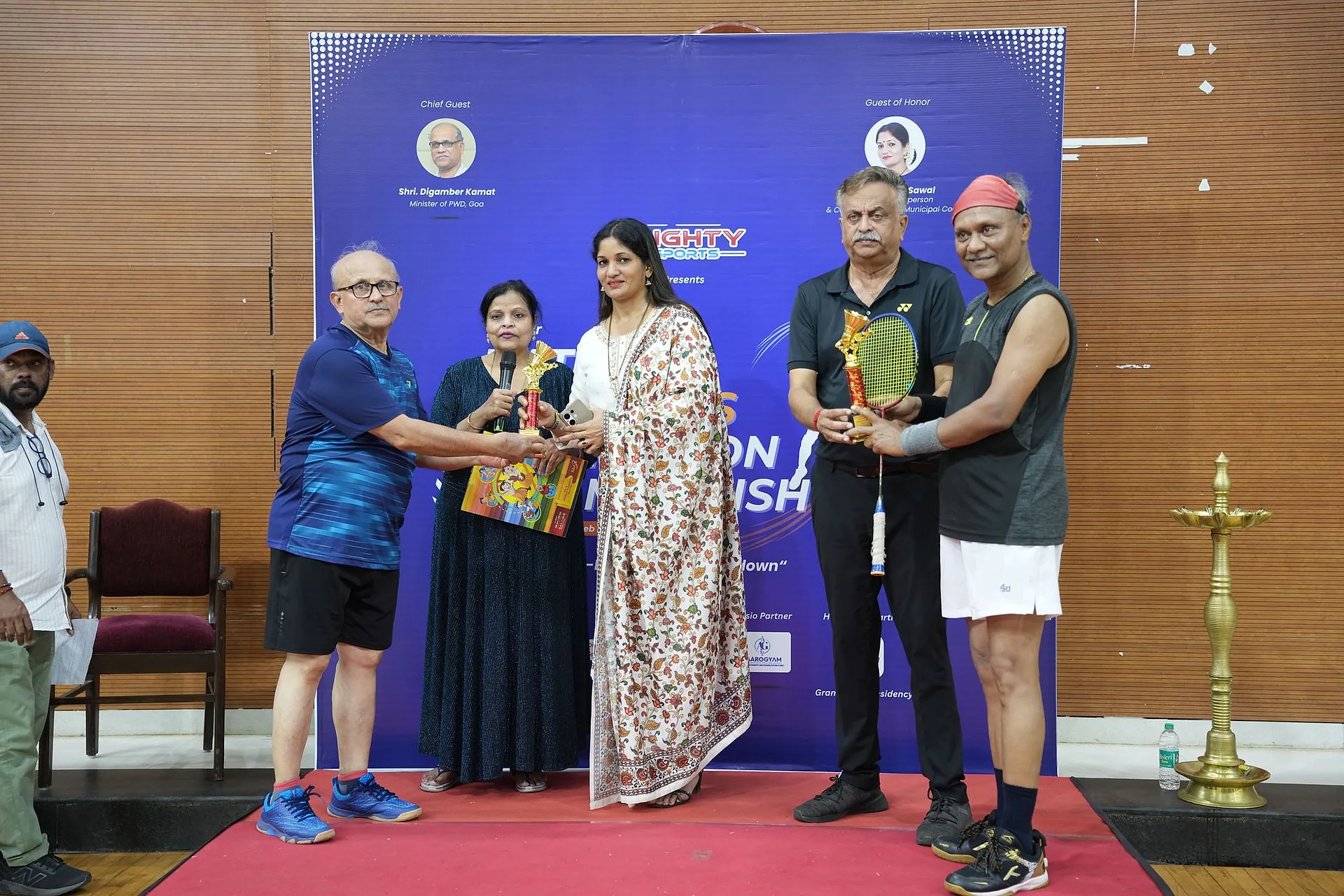 Players receiving trophies from guests at the prize-giving ceremony
